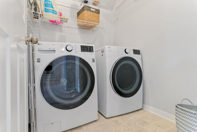 16803 Black Kettle Dr, Leander, TX 78641 - laundry area with washer and dryer and light tile patterned flooring