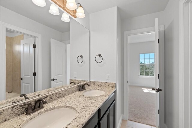8508 Lookout Cliff Pass, Austin, TX 78737 - bathroom featuring double vanity, tile patterned flooring, and baseboards