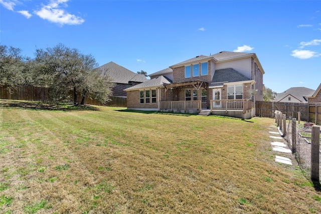 8508 Lookout Cliff Pass, Austin, TX 78737 - back of house featuring brick siding, a deck, and roof with shingles