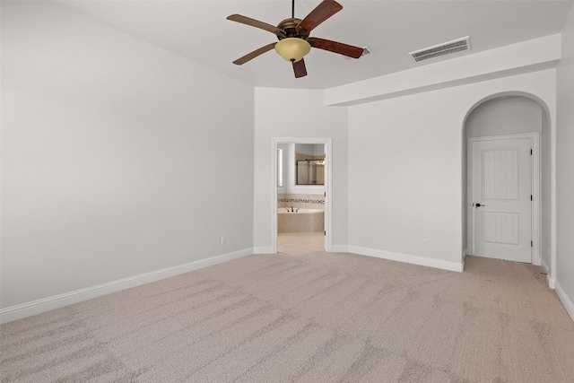 8508 Lookout Cliff Pass, Austin, TX 78737 - unfurnished room with a ceiling fan, light carpet, baseboards, and arched walkways