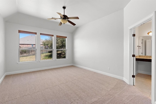 8508 Lookout Cliff Pass, Austin, TX 78737 - unfurnished bedroom featuring lofted ceiling, light carpet, baseboards, connected bathroom, and a ceiling fan