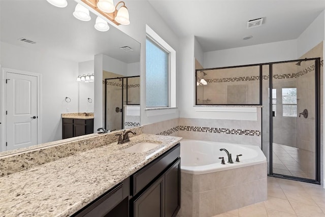 8508 Lookout Cliff Pass, Austin, TX 78737 - bathroom with a shower stall, a jetted tub, vanity, and tile patterned flooring