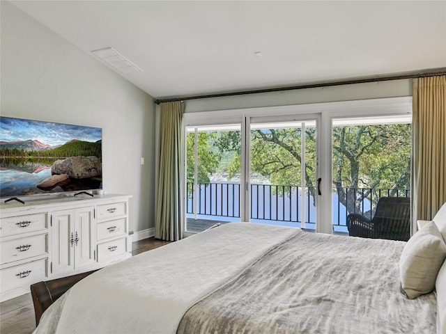 14753 Arrowhead Dr, Austin, TX 78641 - bedroom with access to exterior, multiple windows, and dark wood finished floors