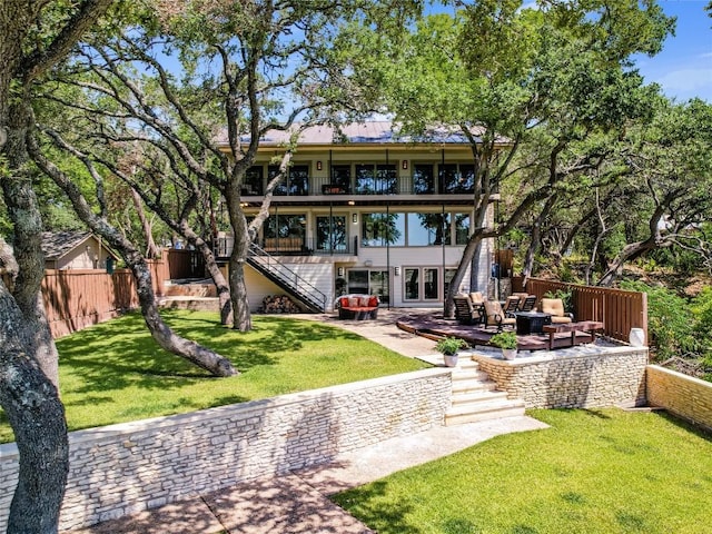 14753 Arrowhead Dr, Austin, TX 78641 - back of property featuring stairs, outdoor lounge area, a patio area, and a balcony