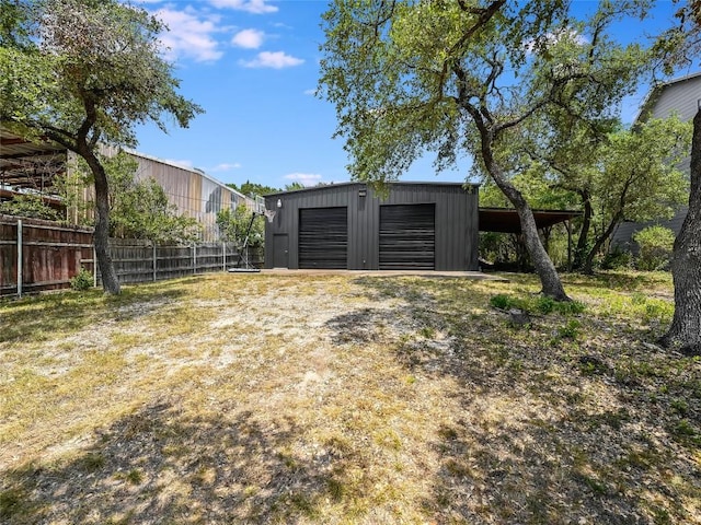 14753 Arrowhead Dr, Austin, TX 78641 - view of yard with a detached garage and an outdoor structure