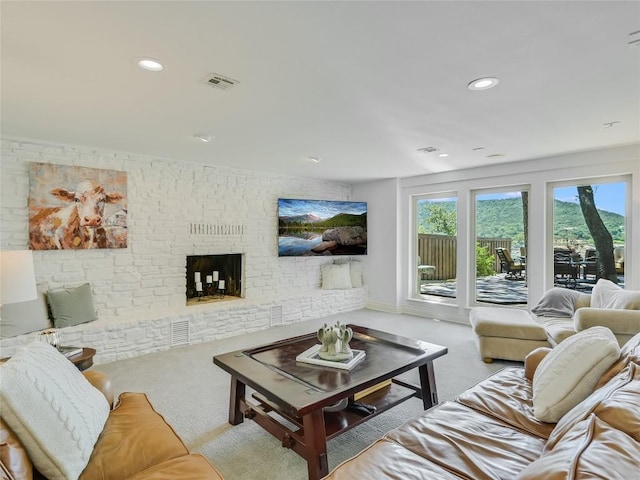 14753 Arrowhead Dr, Austin, TX 78641 - living area with carpet floors, recessed lighting, a fireplace, and baseboards