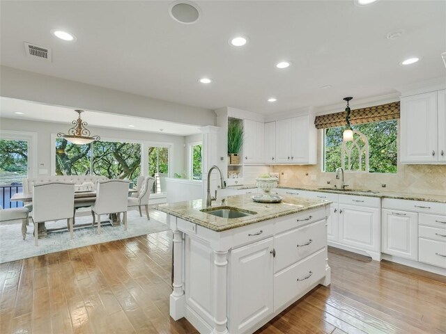 14753 Arrowhead Dr, Austin, TX 78641 - kitchen featuring a sink, light wood-style flooring, plenty of natural light, and recessed lighting