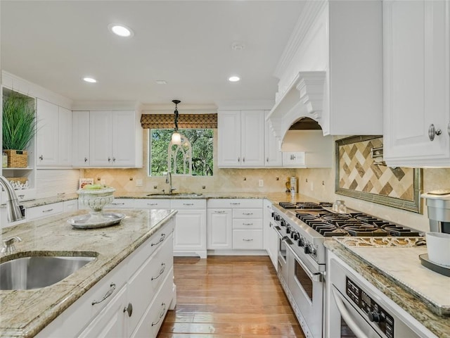 14753 Arrowhead Dr, Austin, TX 78641 - kitchen with a sink, stainless steel appliances, white cabinetry, recessed lighting, and crown molding