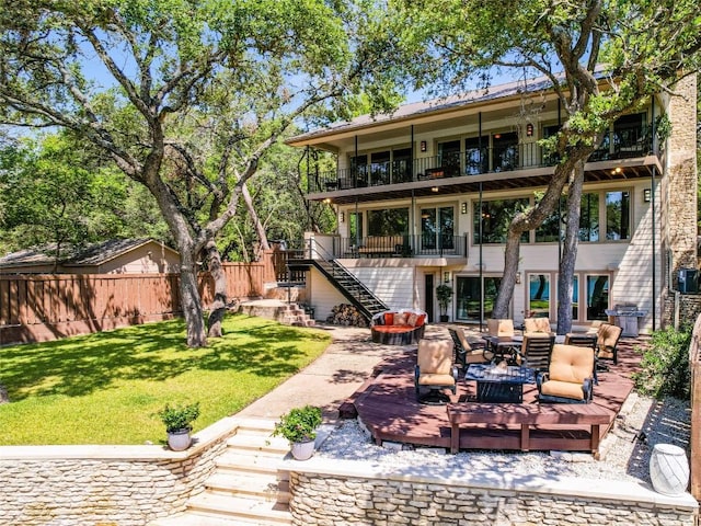14753 Arrowhead Dr, Austin, TX 78641 - back of property featuring a balcony, stairs, an outdoor living space, and a wooden deck