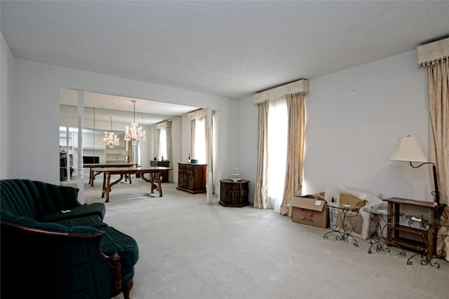10925 Preston Trails Dr, Austin, TX 78747 - sitting room featuring carpet floors and a chandelier