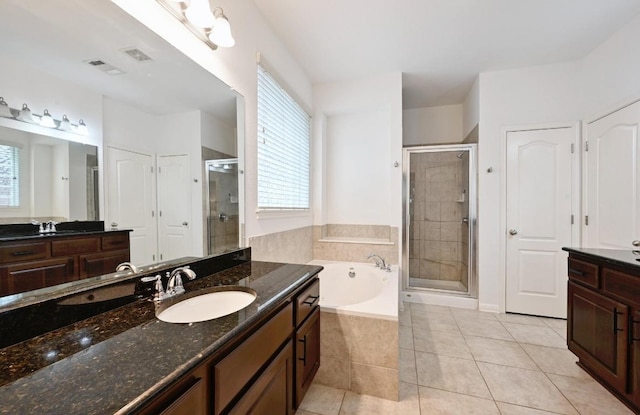 8328 Alophia Dr, Austin, TX 78739 - full bath featuring vanity, a stall shower, a bath, and tile patterned floors