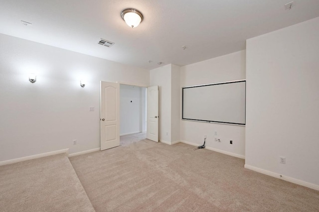 8328 Alophia Dr, Austin, TX 78739 - home theater room featuring light carpet and baseboards