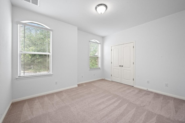 8328 Alophia Dr, Austin, TX 78739 - unfurnished bedroom featuring carpet, baseboards, and a closet