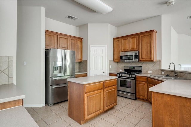 728 Stokesay Castle Path, Pflugerville, TX 78660 - kitchen with stainless steel appliances, a sink, backsplash, light countertops, and brown cabinets