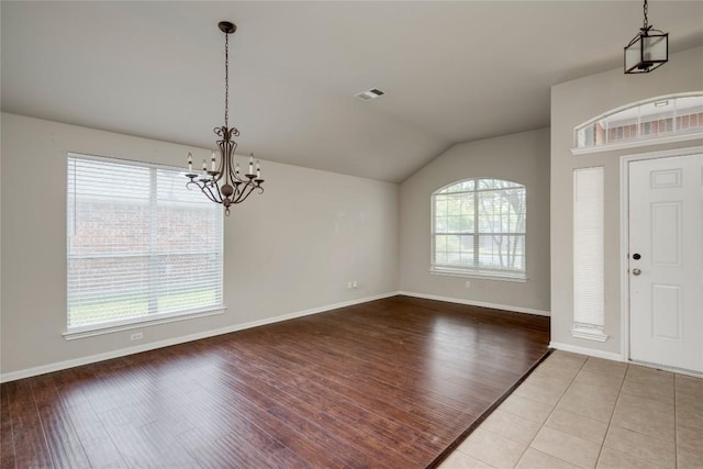 728 Stokesay Castle Path, Pflugerville, TX 78660 - foyer with lofted ceiling, a chandelier, and wood finished floors