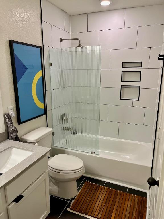 14217 Silver Lace Ln, Pflugerville, TX 78660 - bathroom with vanity, tile patterned flooring, and bathtub / shower combination
