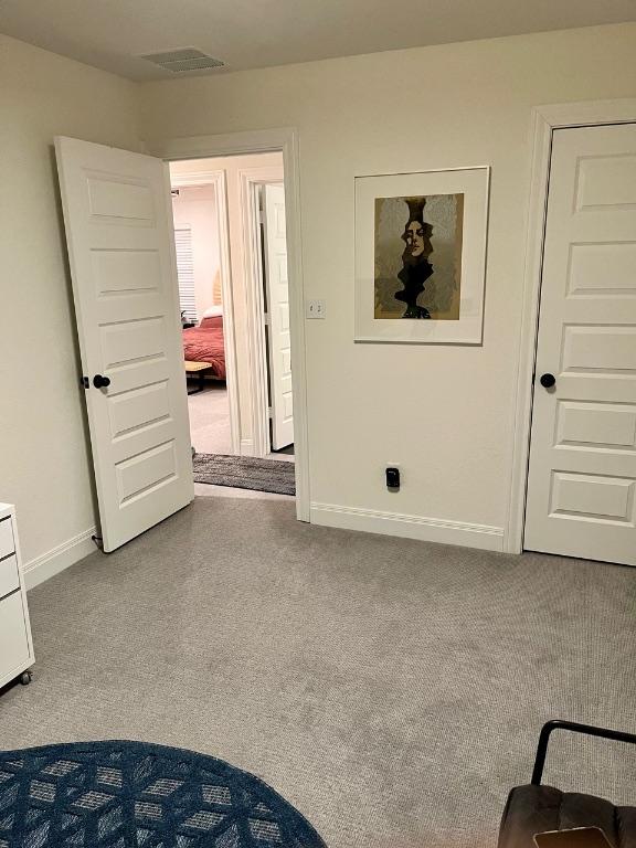 14217 Silver Lace Ln, Pflugerville, TX 78660 - unfurnished bedroom with baseboards and carpet flooring