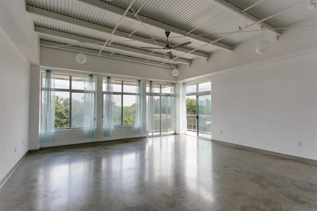 2401 E 6th St Unit 80, Austin, TX 78702 - spare room featuring baseboards, plenty of natural light, and ceiling fan