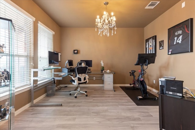 1366 Red Stag Pl, Round Rock, TX 78665 - office with wood finished floors, a chandelier, and healthy amount of natural light