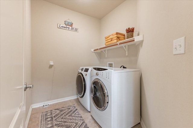 1366 Red Stag Pl, Round Rock, TX 78665 - laundry room featuring washing machine and clothes dryer and light tile patterned floors