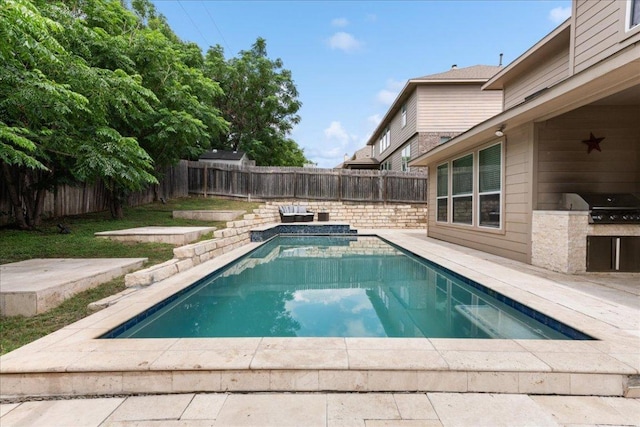 1366 Red Stag Pl, Round Rock, TX 78665 - view of swimming pool featuring an outdoor kitchen, a fenced backyard, and a patio area