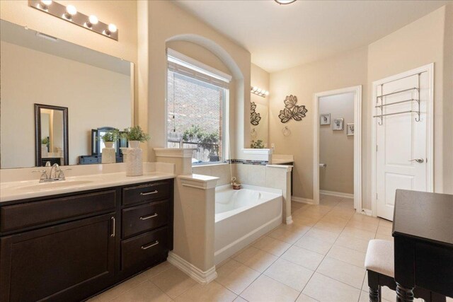 1366 Red Stag Pl, Round Rock, TX 78665 - full bath featuring vanity, a garden tub, and tile patterned flooring