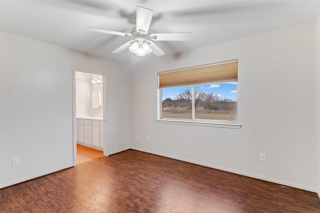 8319 County Road 200, Burnet, TX 78611 - unfurnished room featuring wood finished floors, a ceiling fan, and baseboards