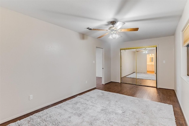 8319 County Road 200, Burnet, TX 78611 - unfurnished bedroom featuring wood finished floors, a closet, ceiling fan, and baseboards