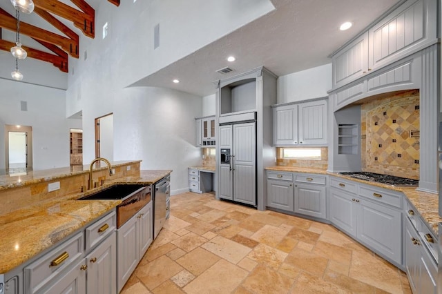 144 Serene St, Spring Branch, TX 78070 - kitchen featuring stainless steel appliances, gray cabinetry, a towering ceiling, tasteful backsplash, and stone tile flooring