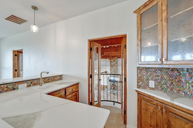144 Serene St, Spring Branch, TX 78070 - bathroom with vanity, backsplash, and tile patterned floors