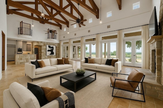 144 Serene St, Spring Branch, TX 78070 - living area with high vaulted ceiling, a ceiling fan, beam ceiling, french doors, and light tile patterned flooring