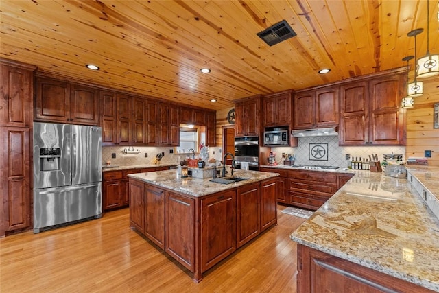 2951 County Road 360, Bartlett, TX 76511 - kitchen with stainless steel appliances, light wood-style flooring, wood ceiling, light stone counters, and a sink