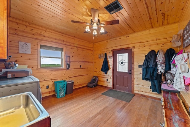 2951 County Road 360, Bartlett, TX 76511 - foyer featuring separate washer and dryer, plenty of natural light, wood ceiling, light wood-style flooring, and ceiling fan