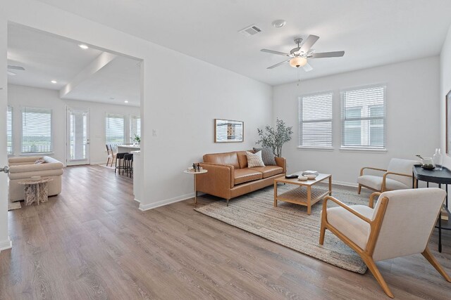 529 Leeward Pass, Leander, TX 78641 - living room featuring ceiling fan, wood finished floors, and recessed lighting