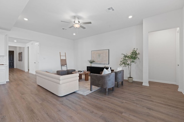 529 Leeward Pass, Leander, TX 78641 - living area with a ceiling fan, wood finished floors, and recessed lighting