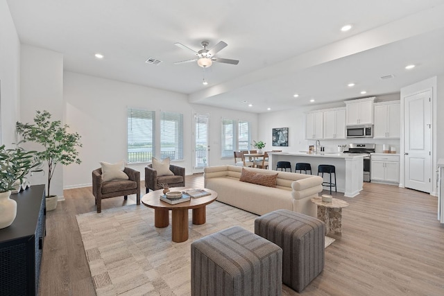 529 Leeward Pass, Leander, TX 78641 - living room featuring ceiling fan, light wood-type flooring, and recessed lighting