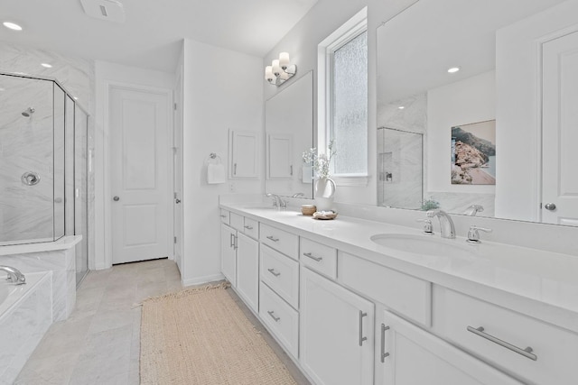 529 Leeward Pass, Leander, TX 78641 - full bathroom with a marble finish shower, double vanity, a tub with marble appearance, tile patterned floors, and recessed lighting