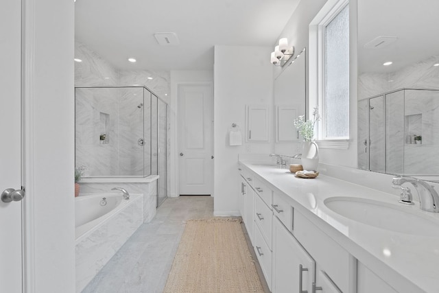 529 Leeward Pass, Leander, TX 78641 - full bath with a bath, a marble finish shower, double vanity, and recessed lighting