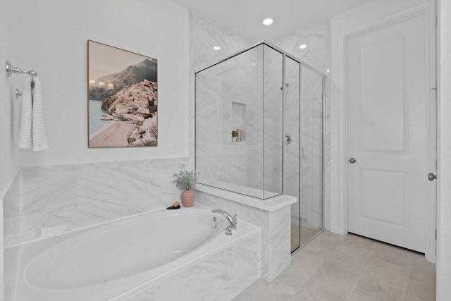 529 Leeward Pass, Leander, TX 78641 - bathroom featuring a bath and a marble finish shower