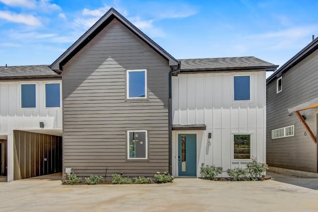 4127 E 12th St Unit 5, Austin, TX 78721 - view of front of property with board and batten siding and roof with shingles