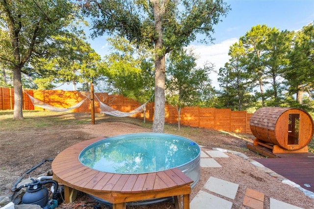 121 Kaelepulu Dr, Bastrop, TX 78602 - view of swimming pool with a fenced backyard and a wooden deck