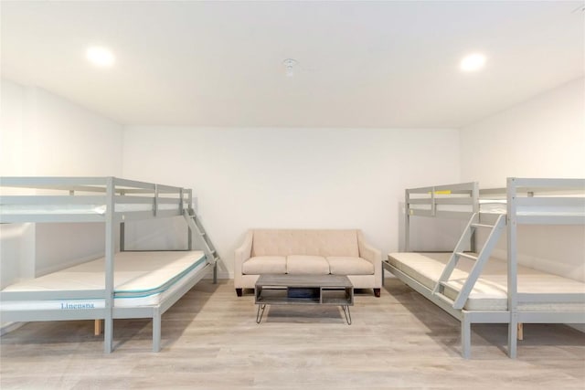 121 Kaelepulu Dr, Bastrop, TX 78602 - bedroom featuring wood finished floors and recessed lighting