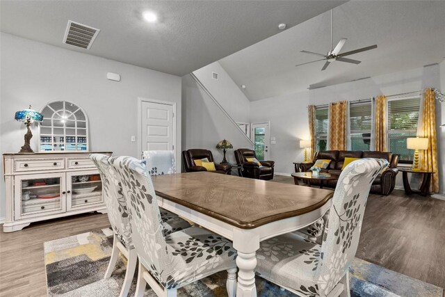 12705 Twisted Root Dr, Manchaca, TX 78652 - dining area featuring wood finished floors, lofted ceiling, and a ceiling fan