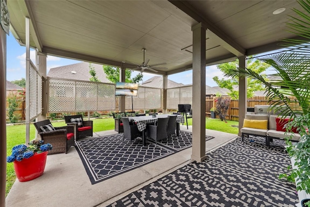 12705 Twisted Root Dr, Manchaca, TX 78652 - fenced backyard featuring an outdoor hangout area, a ceiling fan, a patio area, and outdoor dining space