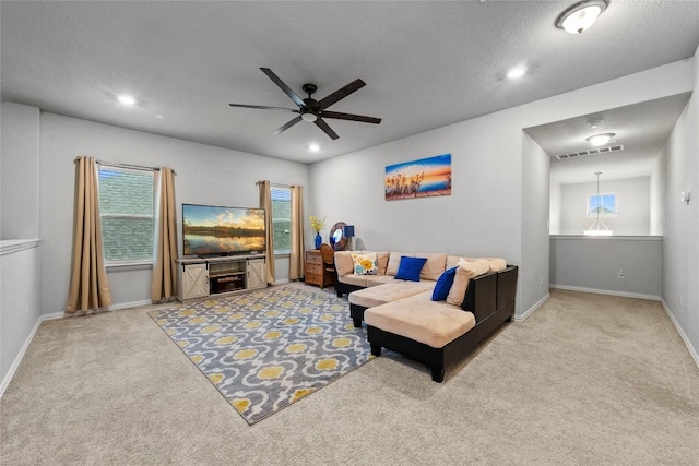 12705 Twisted Root Dr, Manchaca, TX 78652 - carpeted living area with ceiling fan and recessed lighting