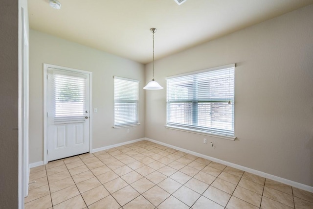 1605 Atlas Rd, Cedar Park, TX 78613 - unfurnished dining area with light tile patterned floors and baseboards