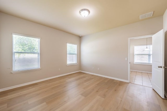 1605 Atlas Rd, Cedar Park, TX 78613 - spare room with light wood-style floors, healthy amount of natural light, and baseboards