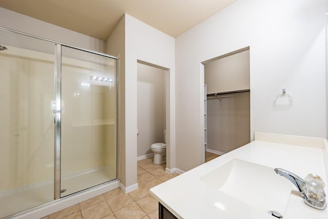 1605 Atlas Rd, Cedar Park, TX 78613 - full bath with vanity, a shower stall, tile patterned flooring, and toilet