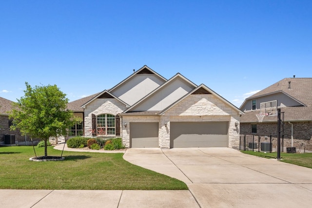 609 Glacial Stream Ln, Cedar Park, TX 78613 - view of front of home featuring a garage, a front yard, stone siding, driveway, and central AC