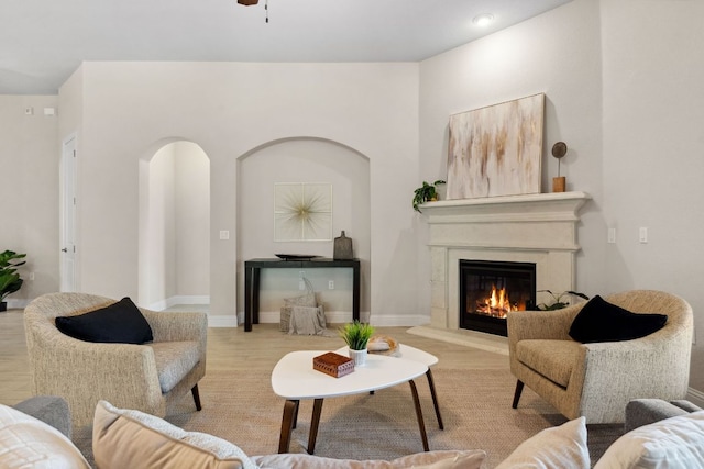609 Glacial Stream Ln, Cedar Park, TX 78613 - living room featuring a glass covered fireplace, wood finished floors, and ceiling fan
